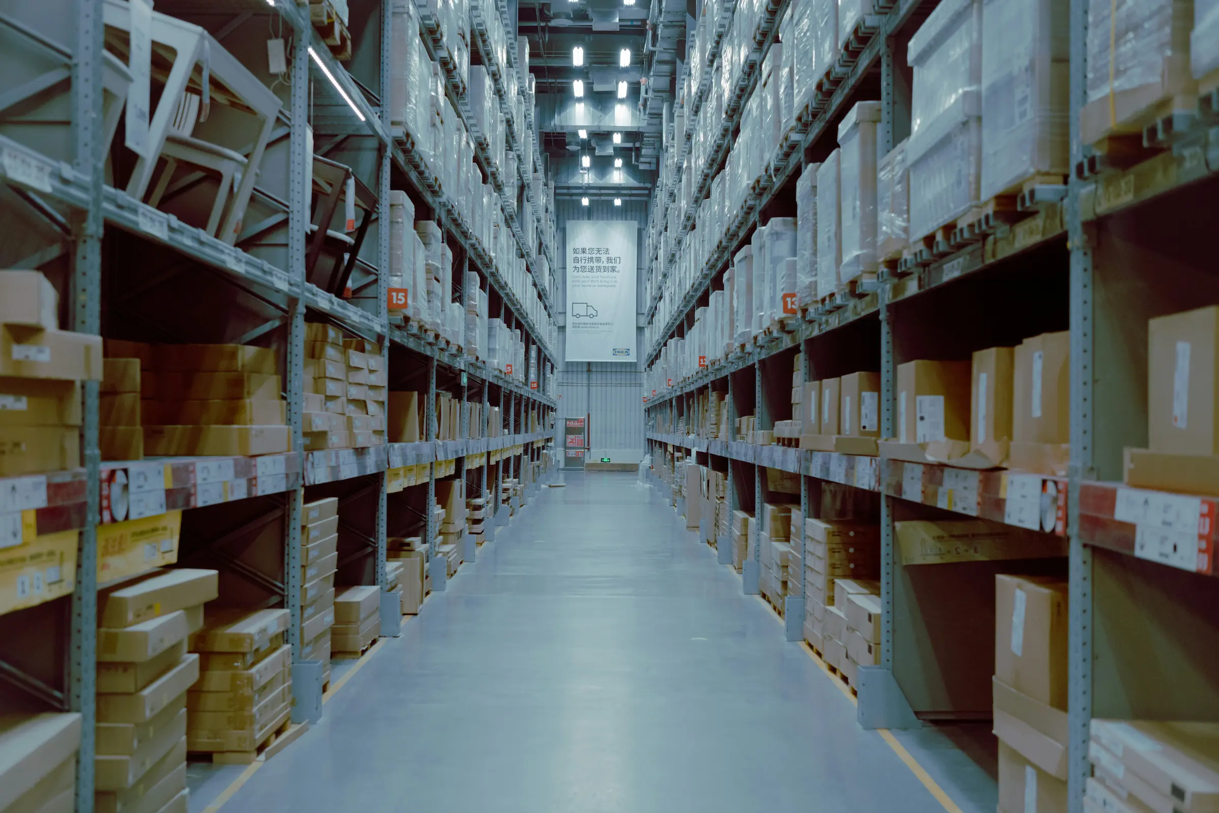 Large warehouse distribution facility filled with storage shelving