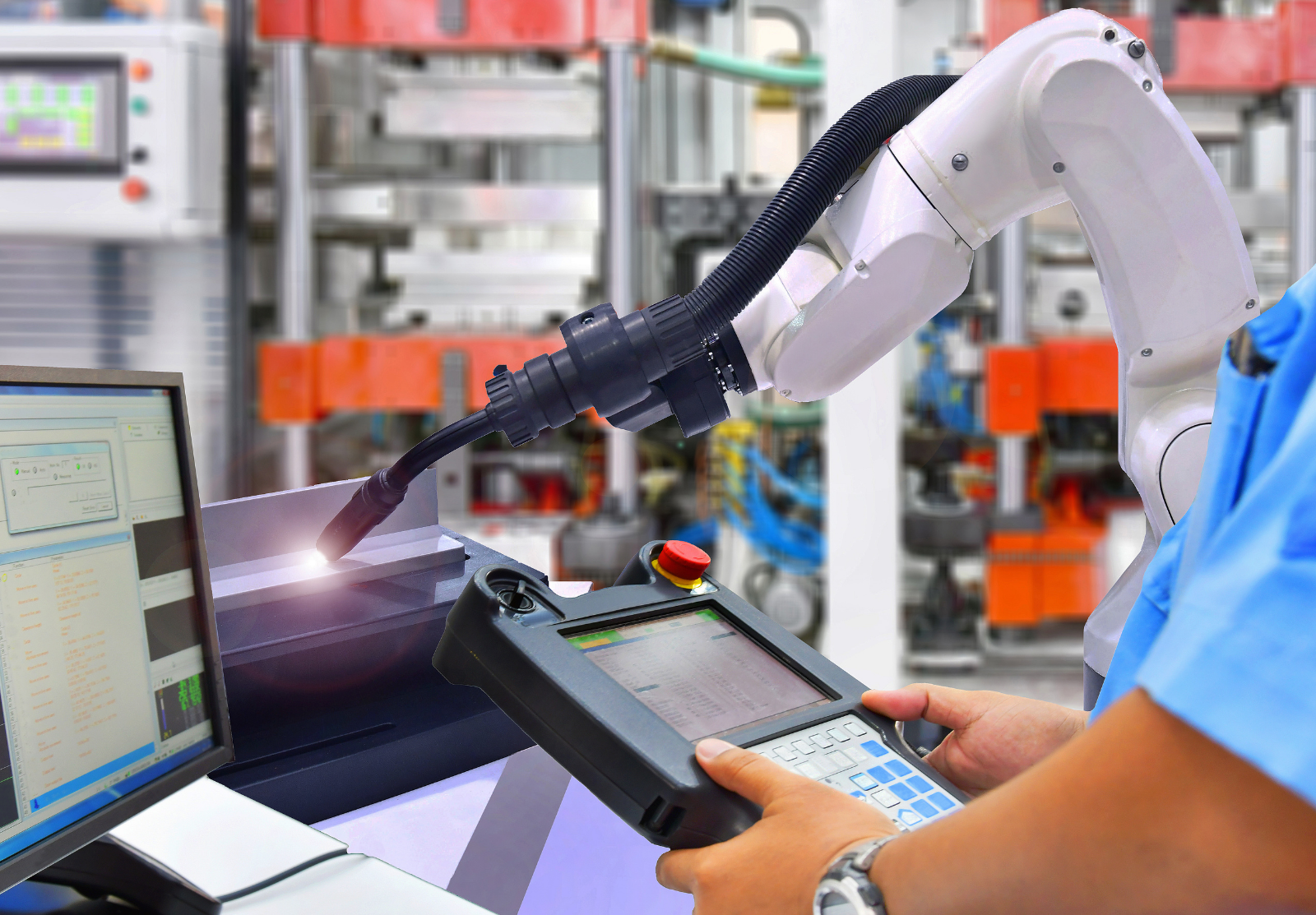 A team of people working together on a factory production floor